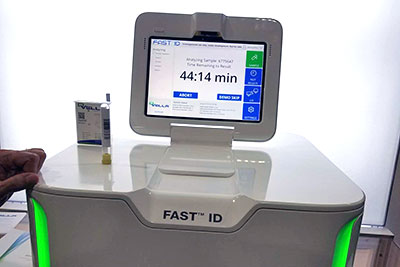 Qvella FAST ID diagnostic instrument with its touchscreen and sample-processing unit.
